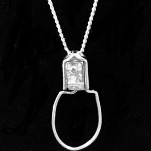 Womans long silver Monet necklace.